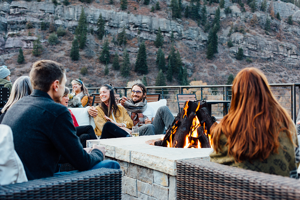 A great conversation happening around the fire at the Imogene rooftop bar.
